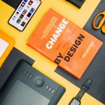 change-by-design-by-tim-brown-book-beside-smartphone-iyanci0cyrk